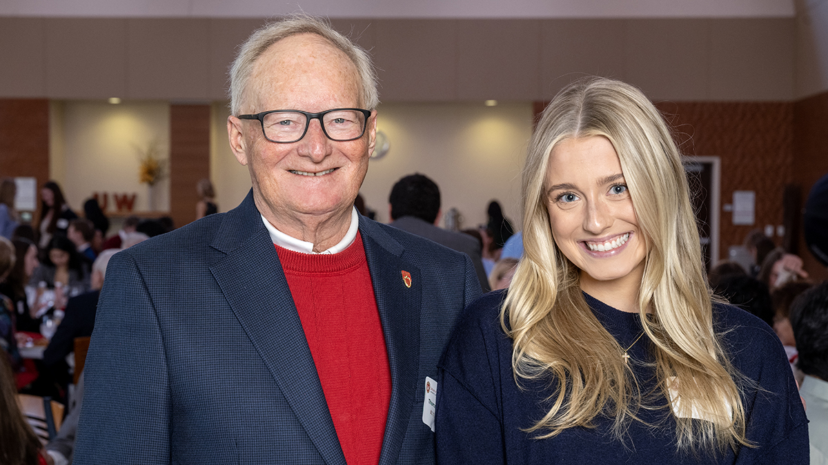 Quinlan Chesak and Tom Thielke smile for a photo