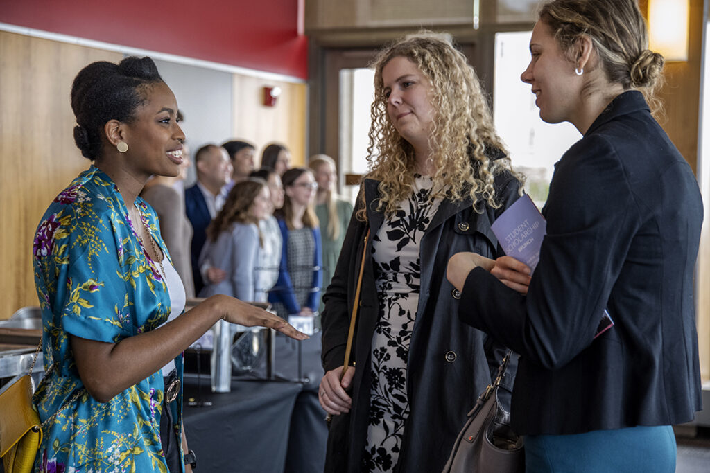 Second-year PharmD student Maria Hill chats with Maria Golovkina and Kendall Smith at the School of Pharmacy Scholarship Brunch at the Pyle Center on April 10, 2022