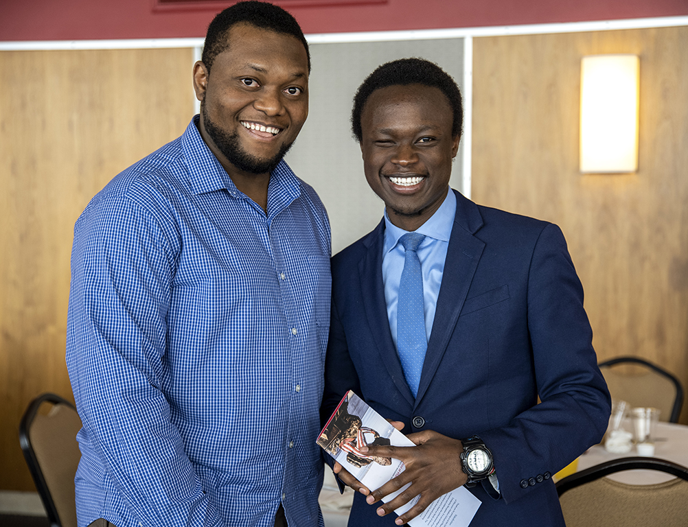 Second-year PharmD students Michael Nome and Vincent Elijah pose for a photo op during the School of Pharmacy Scholarship Brunch on Sunday, April 10, 2022.