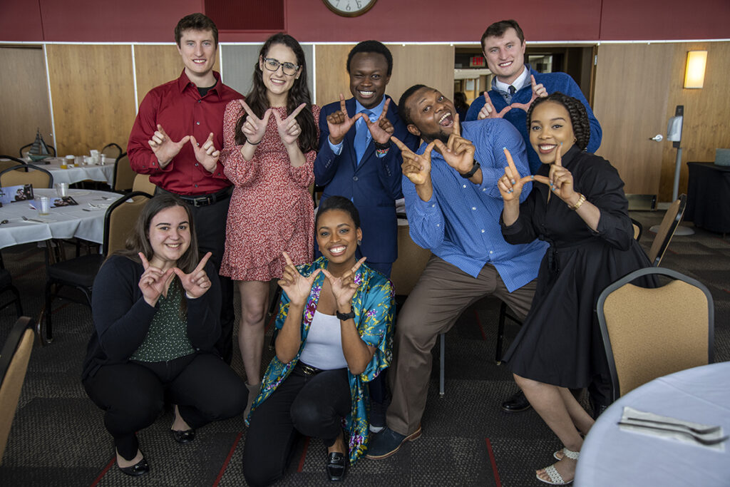 PharmD students grab a silly photo op after the 2022 School of Pharmacy Scholarship Brunch. Front row: Madeline Szubert, Maria Hill. Back row: McKay Carstens, Caroline Palay, Vincent Elijah, Michael Nome, Kane Carstens, and Mary Ann Egbujor