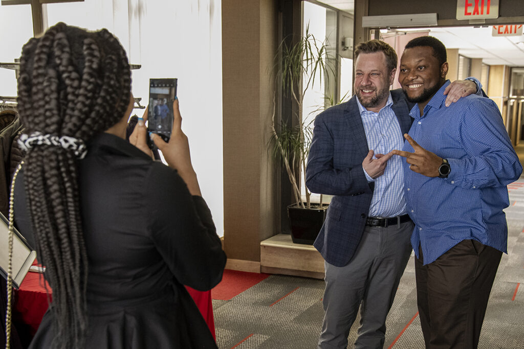 Second-year PharmD student Michael Nome grab a photo op with Jeremy Altschafl, Assistant Dean for Admission, during the 2022 School of Pharmacy Scholarship Brunch.