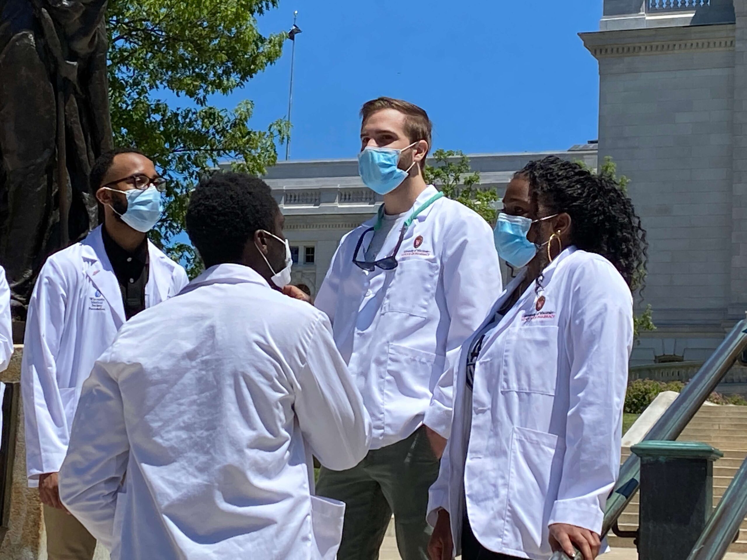 students walking for "White coats for Black Lives' march