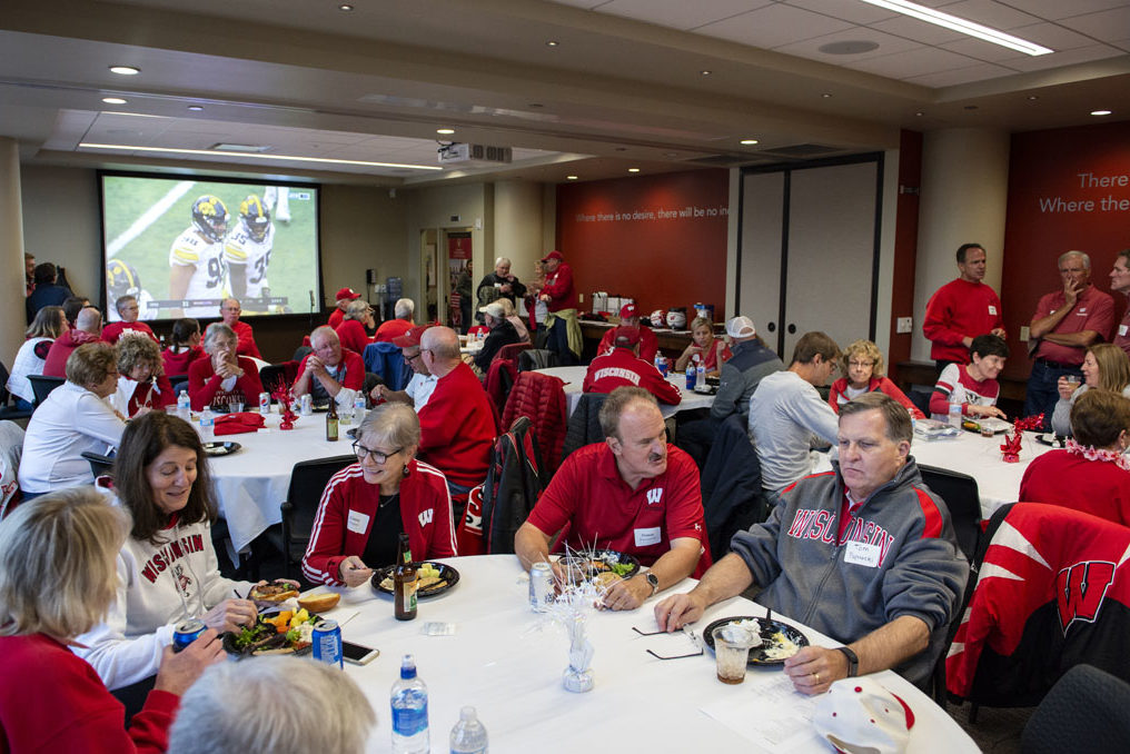 Alumni enjoying a meal at the start of the UW-Madison Pharmacy Alumni Tailgate event, held at Union South during the Badgers vs. Cornhuskers game.