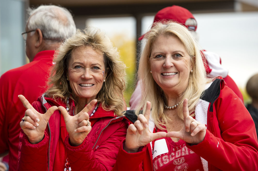 Alumni showing Badger pride at the UW-Madison Pharmacy Alumni Tailgate event, held at Union South during the Badgers vs. Cornhuskers game.