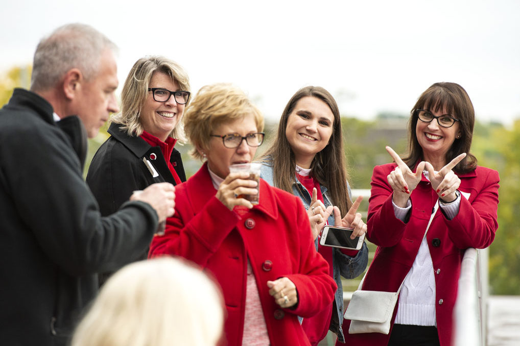 Alumni catching up at the UW-Madison Pharmacy Alumni Tailgate event, held at Union South during the Badgers vs. Cornhuskers game.