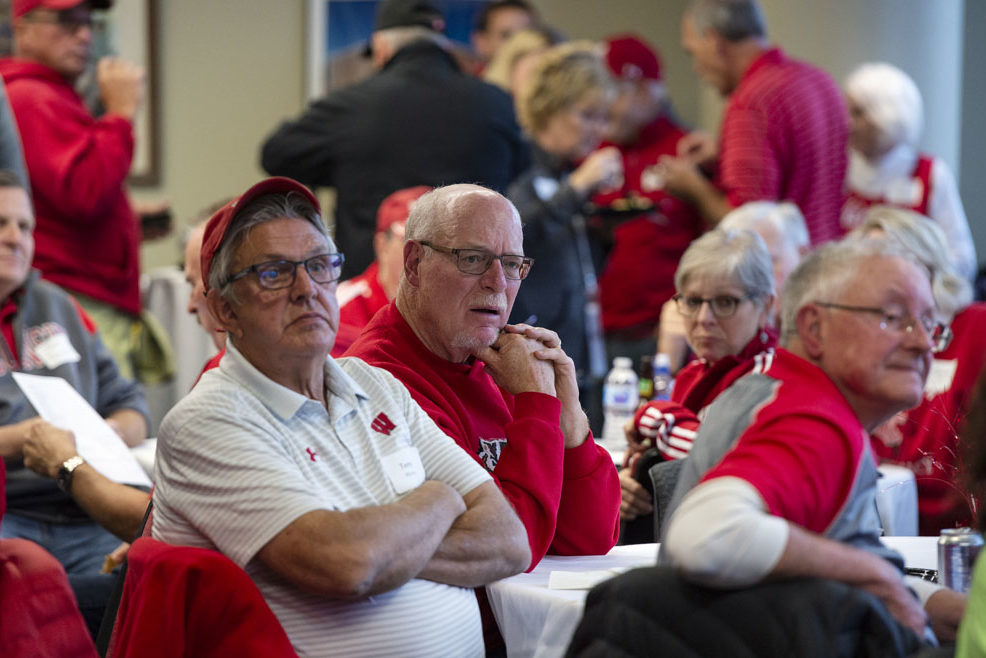 Alumni watching the Badgers vs. Cornhuskers game at the UW-Madison Pharmacy Alumni Tailgate event, held at Union South.