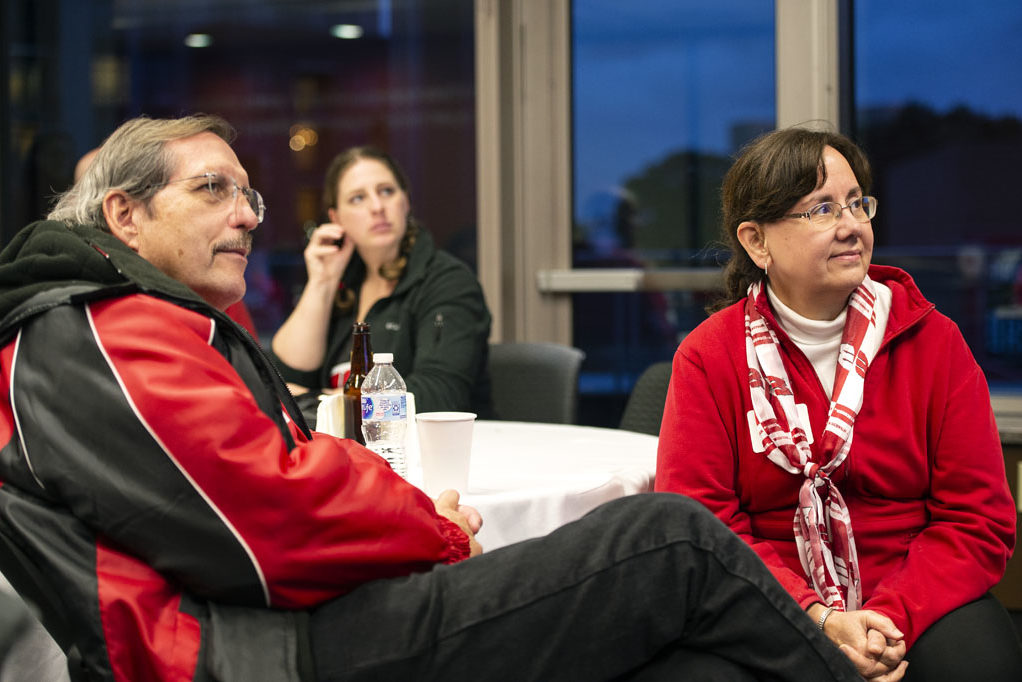 Alumni watching the Badgers vs. Cornhuskers game at the UW-Madison Pharmacy Alumni Tailgate event, held at Union South.