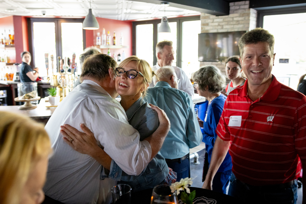 Beth Margin hugs an attendee