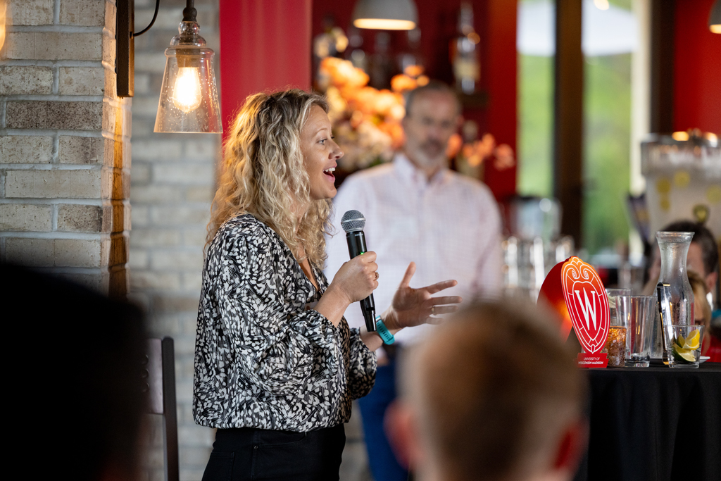 Laura Jester speaks at the microphone