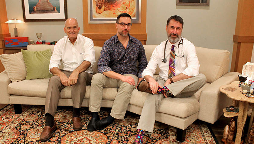 Paul Hutson, Christopher Nicholas, and Randall Brown together on a couch