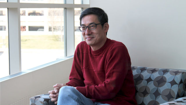 Richard Hsung sitting in a chair