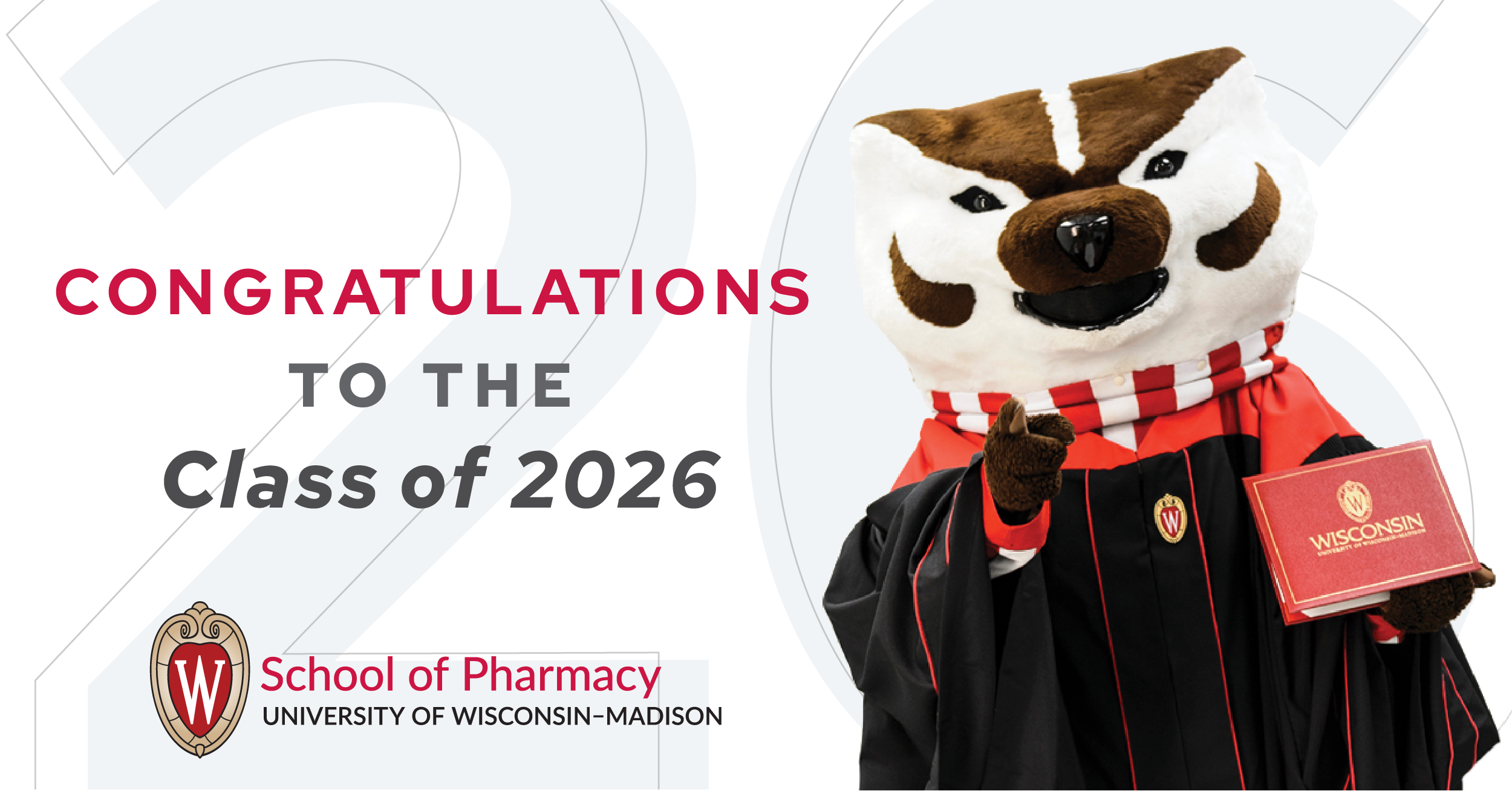 Bucky Badger, dressed in a UW graduation gown, stands next to a note that reads, "Congratulations to the Class of 2026"