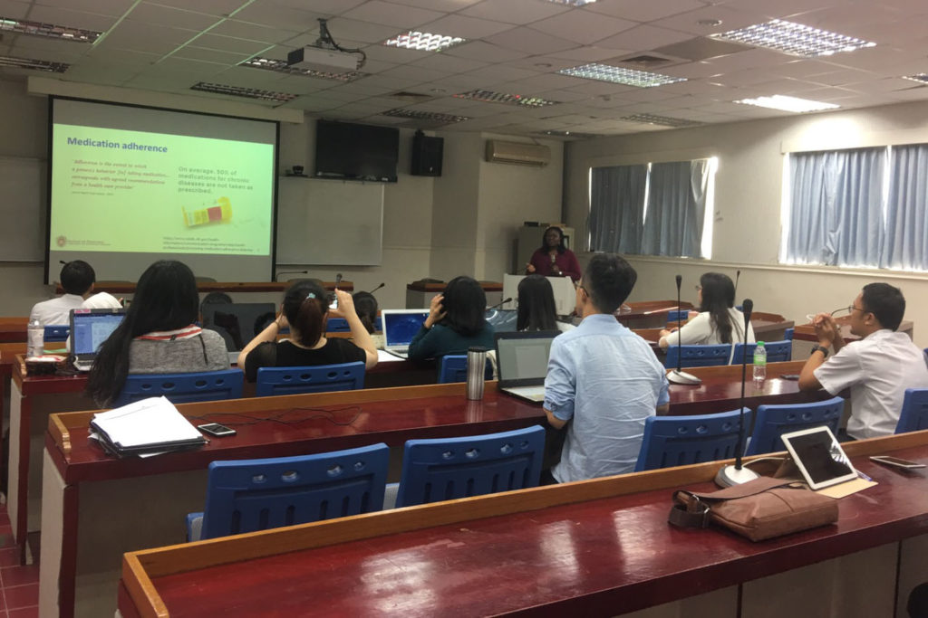 Olayinka Shiyanbola speaking to a lecture hall of students at Taipei Medical University