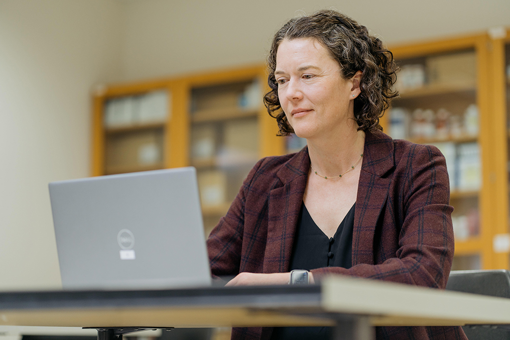 Susie Barnett works at a laptop