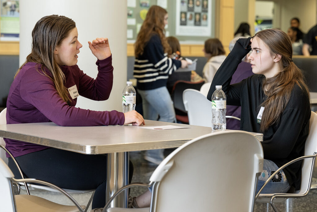 Alexa Vesely, left, and friend Lizzy Mesenberg chat while grabbing a little lunch before the start of the Wonders of Pharmacy on Saturday, March 2, 2024, at the School of Pharmacy on the campus of UW-Madison. (Photo Paul L. Newby, II)