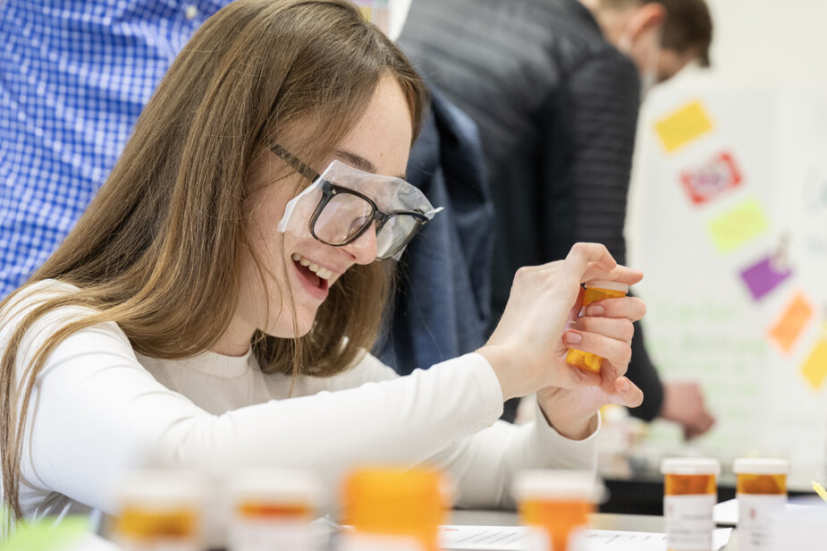 Ava Mueller plays the Pill Boxers game during the Wonders of Pharmacy on Saturday, March 2, 2024, at the School of Pharmacy on the campus of UW-Madison. The game shows geriatric patients' difficulties while sorting and taking their meds. (Photo Paul L. Newby, II)