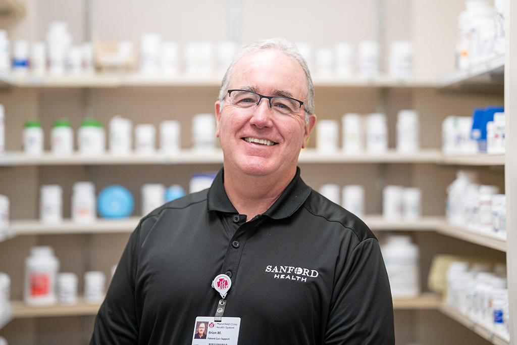 Brian McIlhone portrait in the pharmacy