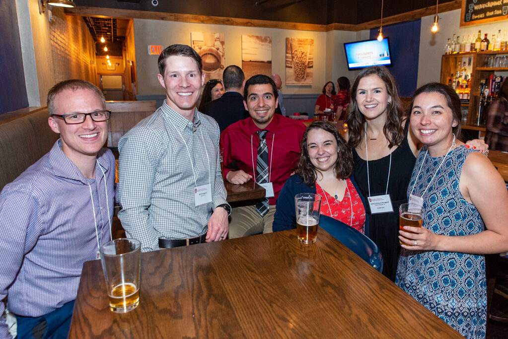 Alumni and attendees together at Cooper's Tavern