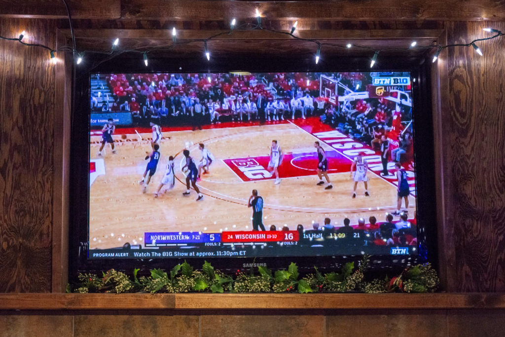 TV displaying Wisconsin vs Northwestern Basketball game