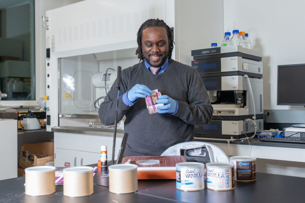 Kwadwo Owusu-Ofori packaging one of his products in a lab