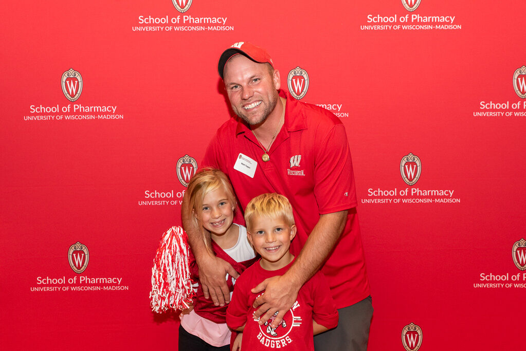 Matt Tepper and two young children pose and smile for a photo.