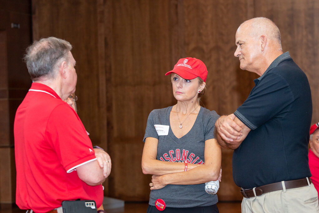 Professor Beth Martin, Professor Paul Hutson, and Russ Jensen engage in conversation.