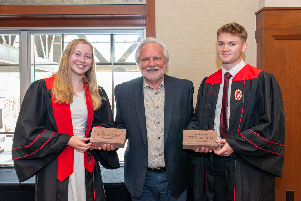 Jeffrey Johnson with graduate students and their brick awards