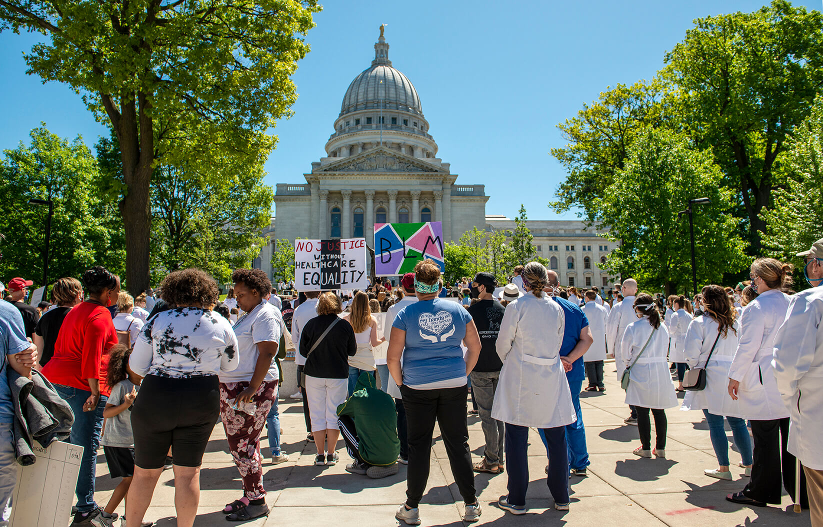 white coats for black lives march happening in front of the capitol building