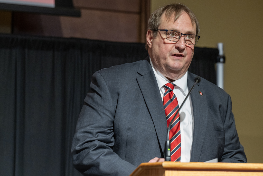 Dean Swanson speaks at a podium