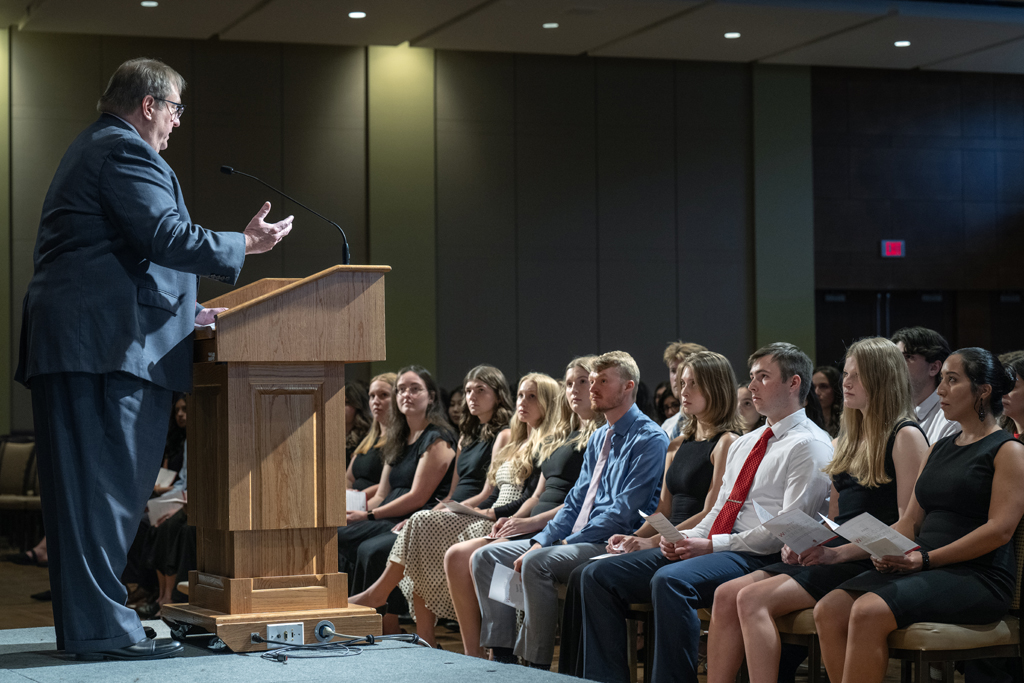 Dean Swanson speaks at a podium