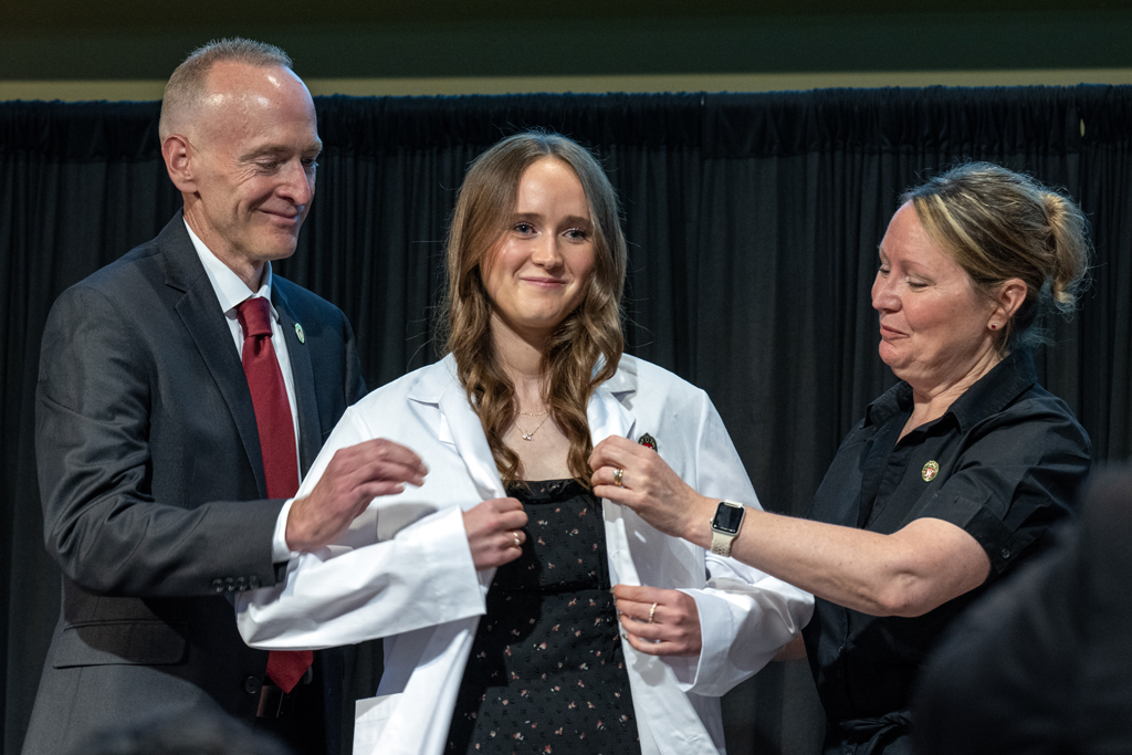 Kate Grunske gets coated by her parents