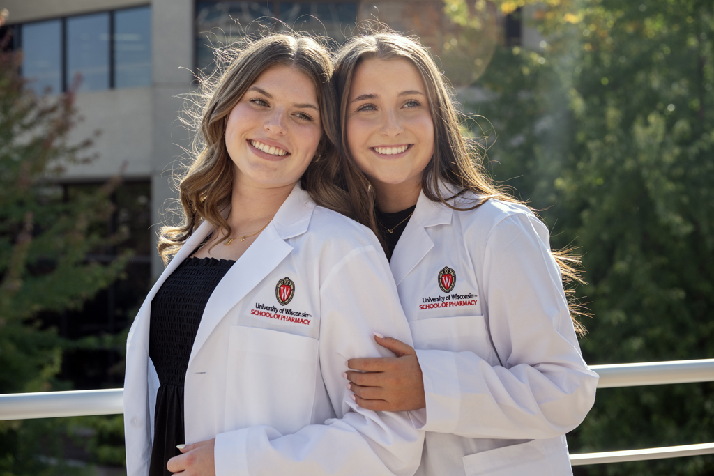 PharmD students pose in their white coats