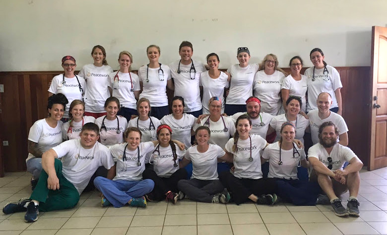A group of health sciences participants in the Belize summer program pose for a group photo