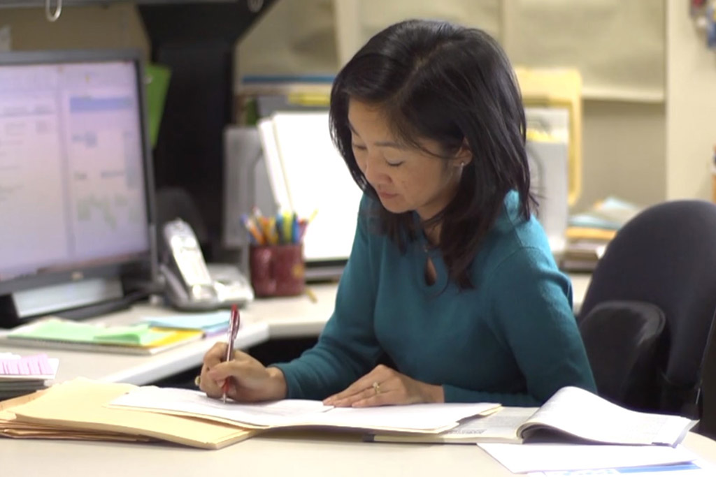 Michelle Chui working at her desk