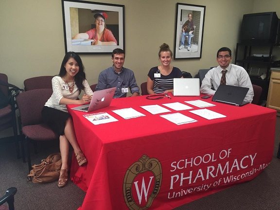 Students and staff running School of Pharmacy table