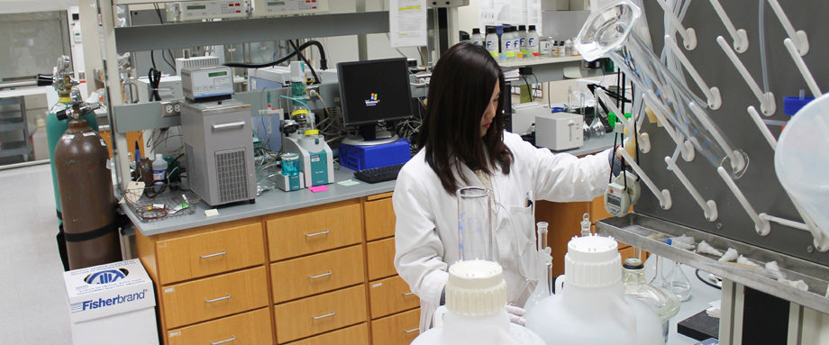 A woman working in a lab