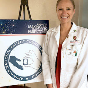Kelsey Waier, DPH-3 student, next to APhA 2017 National Patient Counseling Competition board