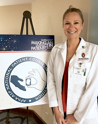 Kelsey Waier, DPH-3 student, next to APhA 2017 National Patient Counseling Competition board