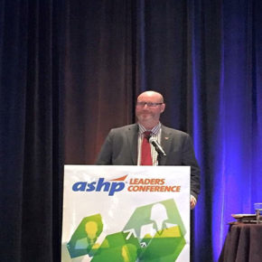 Steve Rough speaking at podium, M.S., FASHP, Senior Director of Pharmacy, UW Health, and Clinical Associate Professor, UW-Madison School of Pharmacy, presenting the 32nd John W. Webb Lecture at the Annual ASHP Conference for Pharmacy Leaders in October 2016 in Boston, Mass.