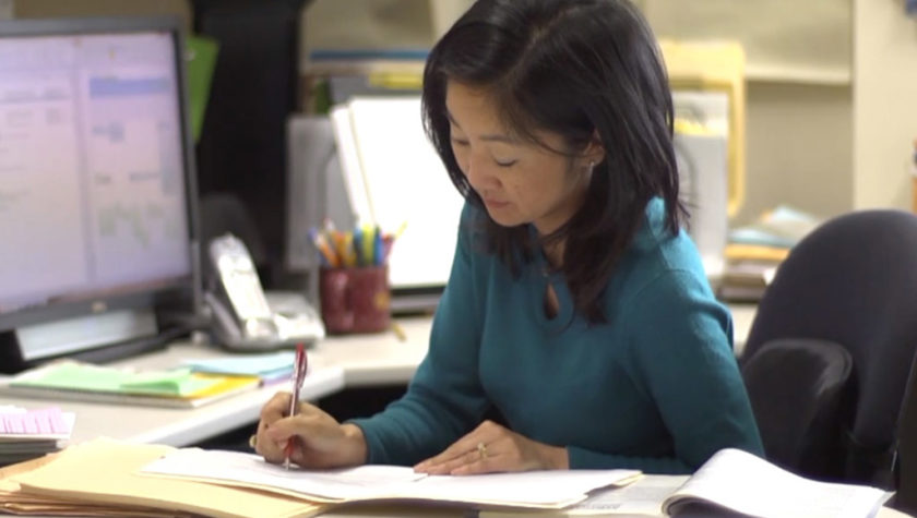 Michelle Chui working at her desk