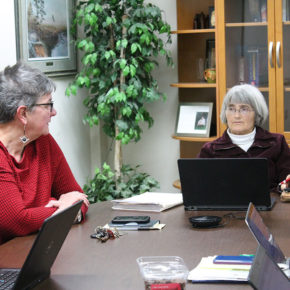 Connie Kraus and Mara Kieser at table during meeting