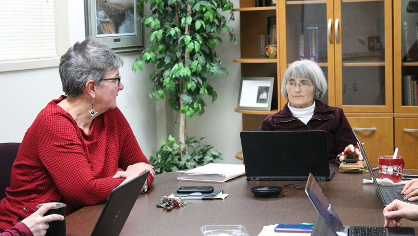 Connie Kraus and Mara Kieser at table during meeting