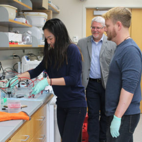 Naomi Do, Michael Taylor, and Kevin Lanham working in the lab