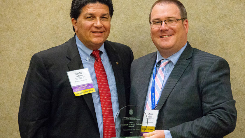 Rocky LaDien and Ryan Miller with his award