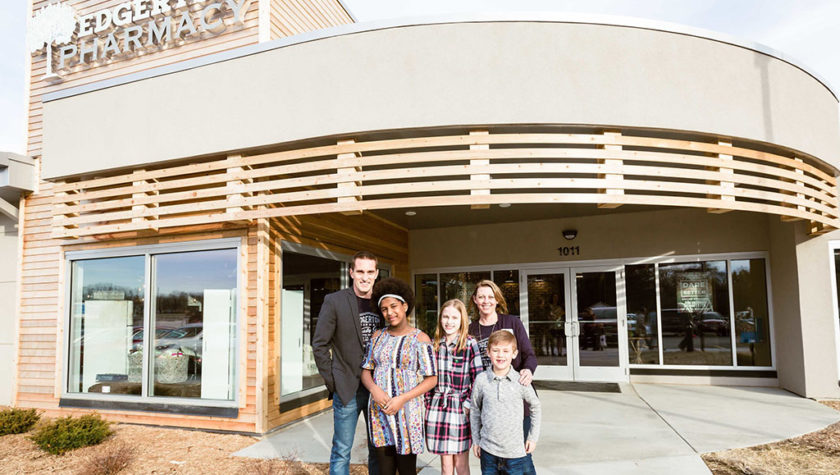 The Gresens standing in front of Edgerton Pharmacy