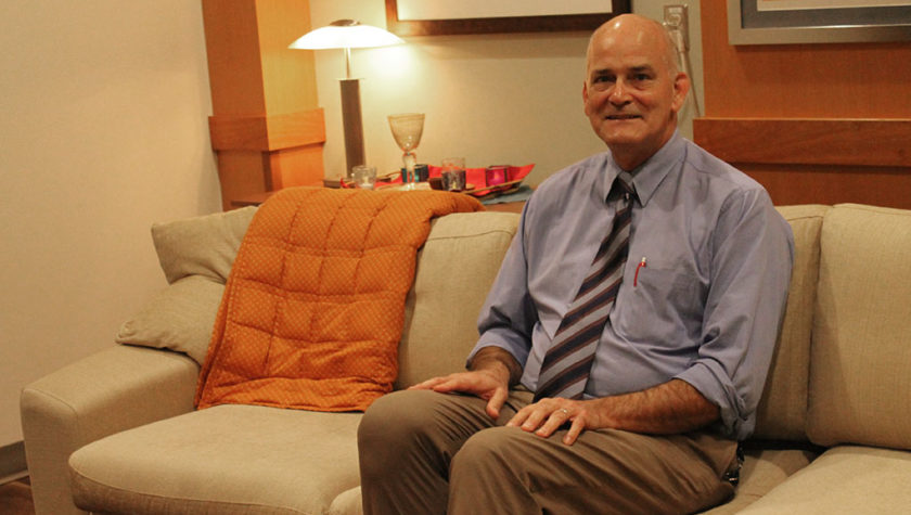 Paul Hutson sitting down in the clinical therapy room