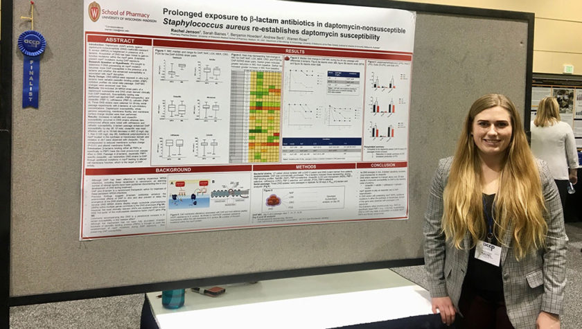 Rachel Jenson standing with her research poster