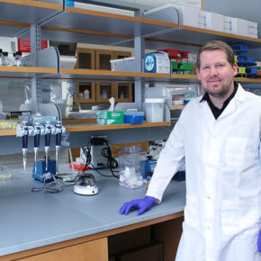 Jason Peters standing at a lab counter