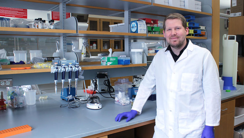 Jason Peters standing at a lab counter