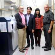 Members of the Nanobiosystems group stand in the lab.